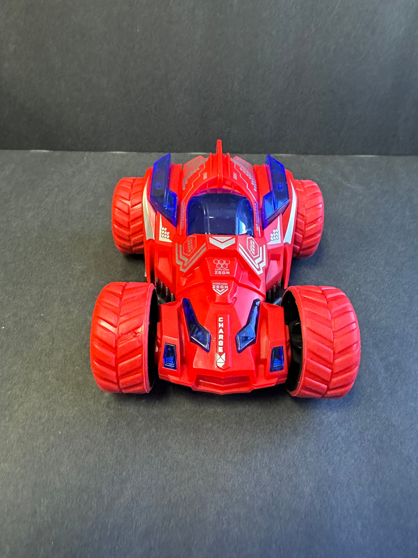 Friction Stunt Cars with 360 Rotating Front Wheels - 4 Differently Colored Hand Held Push-Powered Stunt Cars