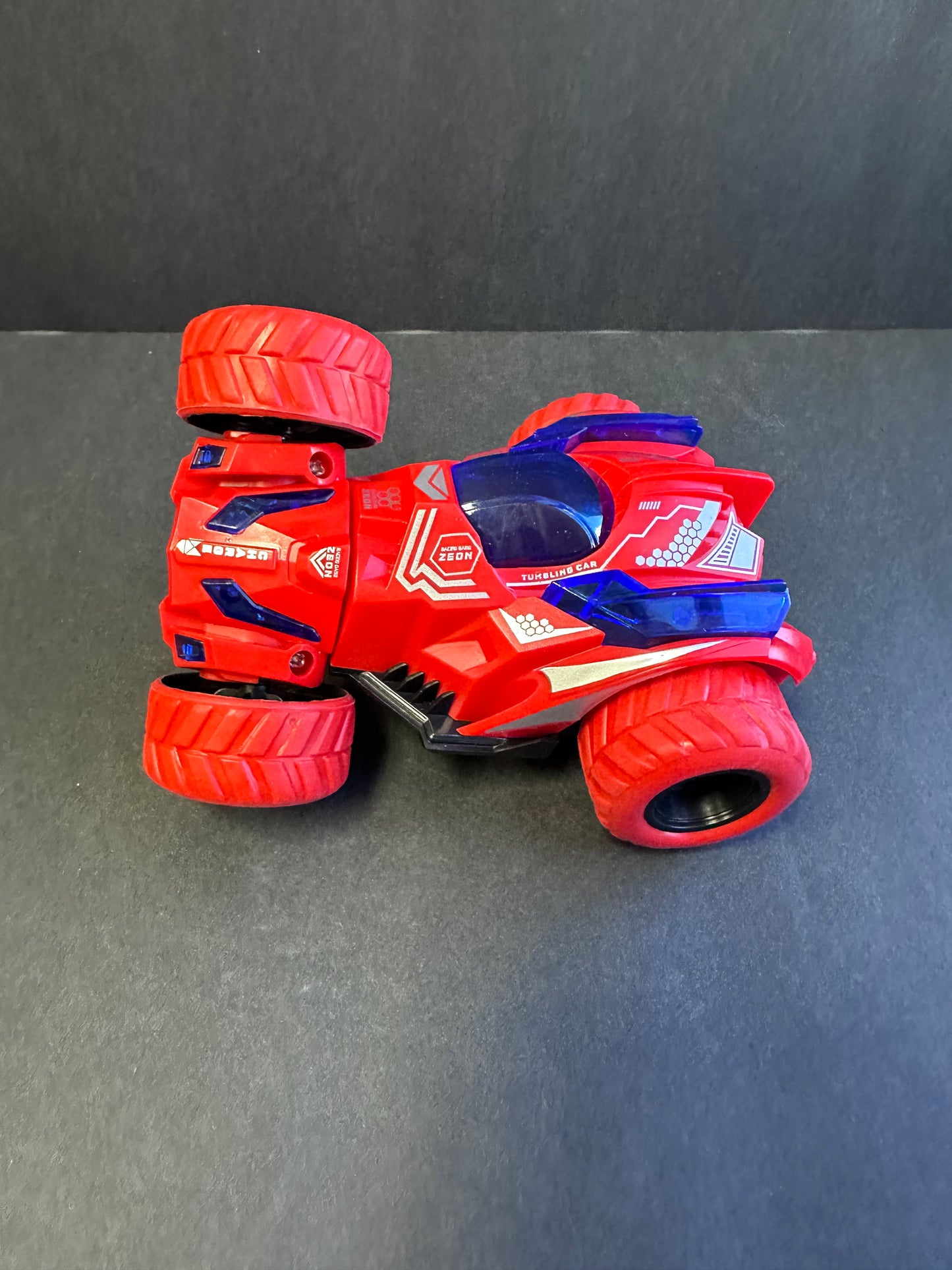 Friction Stunt Cars with 360 Rotating Front Wheels - 4 Differently Colored Hand Held Push-Powered Stunt Cars