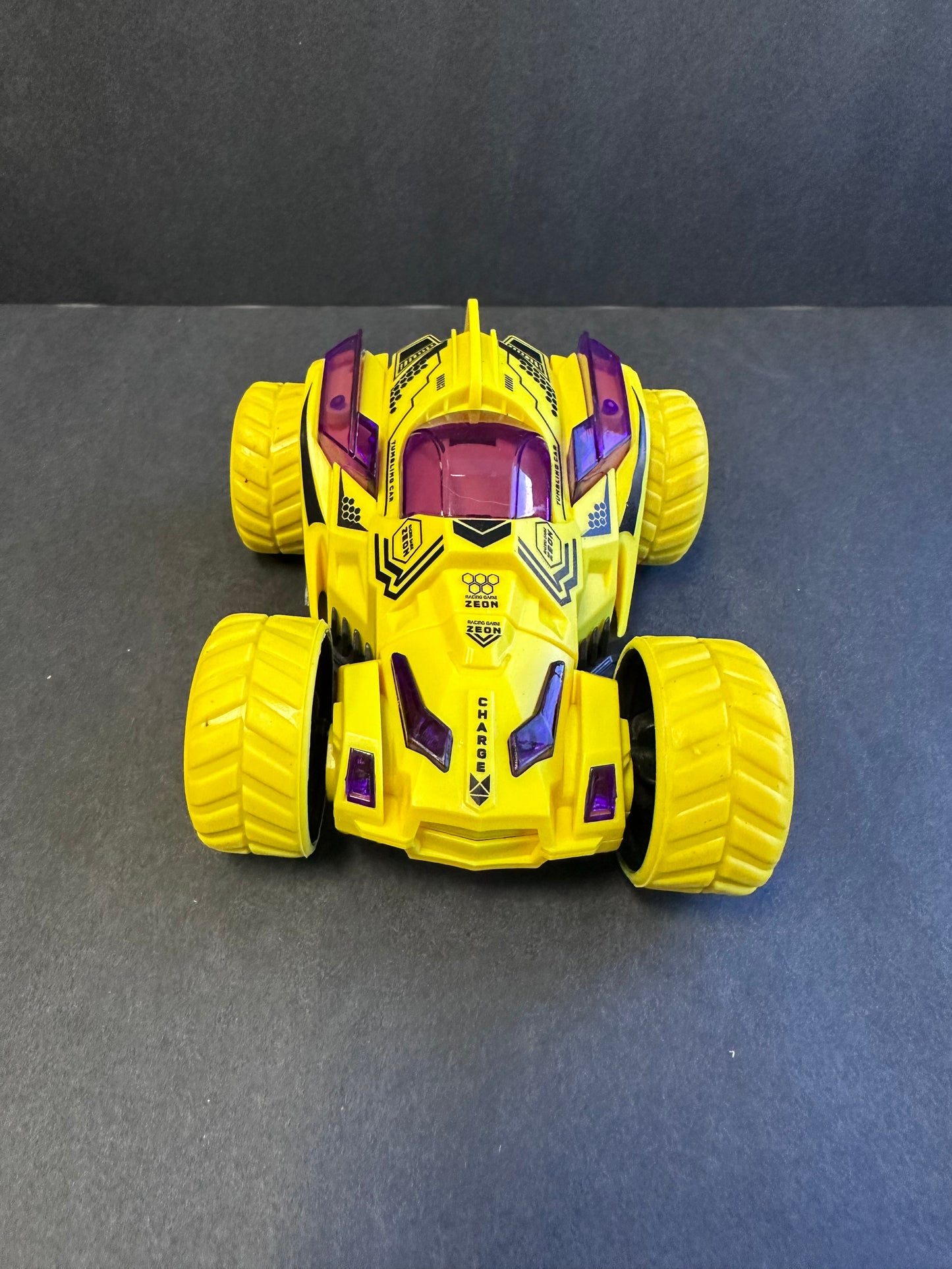 Friction Stunt Cars with 360 Rotating Front Wheels - 4 Differently Colored Hand Held Push-Powered Stunt Cars