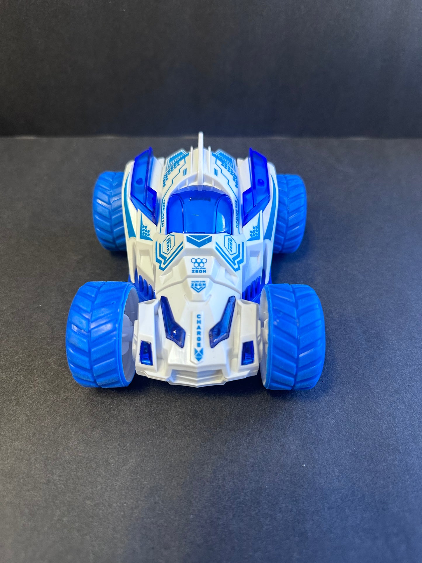 Friction Stunt Cars with 360 Rotating Front Wheels - 4 Differently Colored Hand Held Push-Powered Stunt Cars